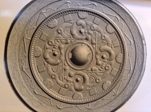 Four "worms" motif on a bronze mirror excavated from a Japanese tumuli of the Kofun period 