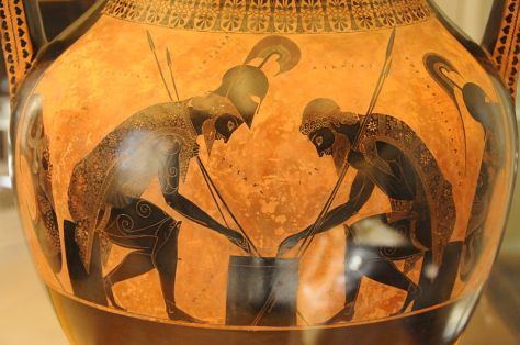 Achilles and Ajax playing a board game. Eight-pointed sun symbols are depicted on their cloaks. Amphora by Exekias, 6th century BC, Vatican Museum Photo: Wikimedia Commons